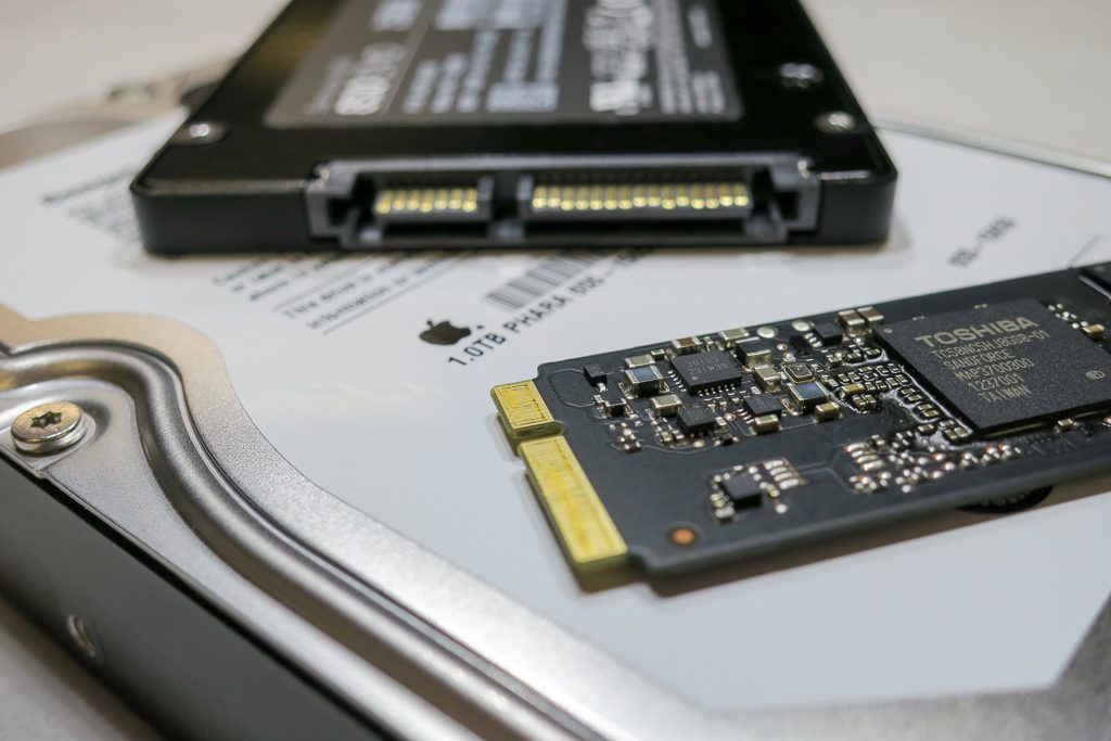 close-up of spinning drive ssd and apple flash storage