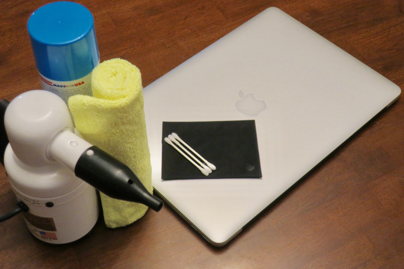 Mac cleaning supplies: compressed air, electronics cleaner, microfiber cloths, Q-tips